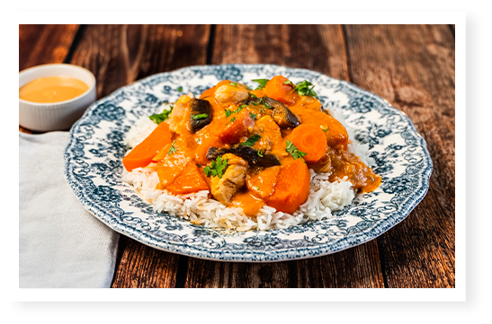 Sauté de veau aux légumes,, riz et sauce beurre de cacahuètes Menguy's.